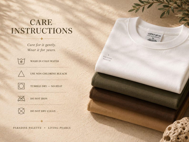 May include: A stack of four folded t-shirts in white, olive green, dark brown, and tan. The white shirt features a small Paradise Palette logo. Text includes Care Instructions, wash in cold water, use non-chlorine bleach, tumble dry no heat, do not iron, and do not dry clean.