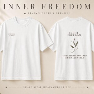 May include: A white short-sleeve t-shirt shown from the front and back. The front features the text PARADISE PALETTE. The back displays the text INNER FREEDOM IS THE ABILITY TO GUARD YOUR INNER WORLD with a graphic of a plant stem and a star.