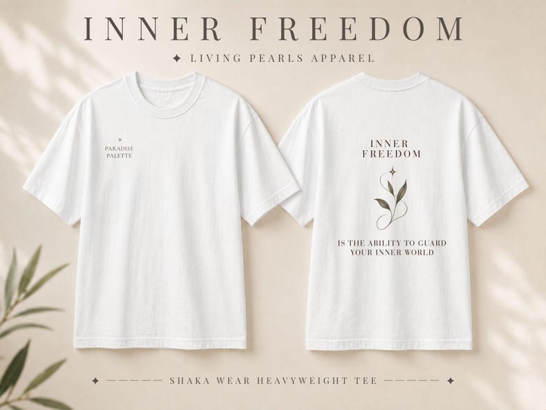 May include: A white short-sleeve t-shirt shown from the front and back. The front features the text PARADISE PALETTE. The back displays the text INNER FREEDOM IS THE ABILITY TO GUARD YOUR INNER WORLD with a graphic of a plant stem and a star.