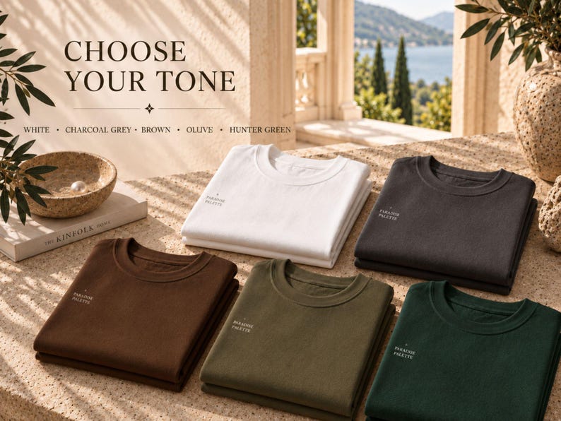 May include: Five folded crewneck sweatshirts in white, charcoal grey, brown, olive, and hunter green. Each shirt features the text "PARADISE PALETTE" printed on the chest. The text "CHOOSE YOUR TONE" and a list of the five available colors are visible.