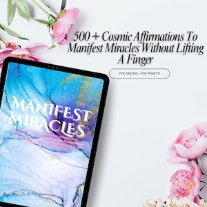 May include: A digital tablet showing the words "Manifest Miracles" with a blue and gold abstract design. The text "500+ Cosmic Affirmations To Manifest Miracles Without Lifting A Finger" is above the tablet. Pink flowers are in the background.