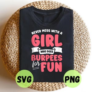 May include: Black t-shirt with the text "NEVER MESS WITH A GIRL WHO DOES BURPEES FOR FUN" in white and pink. The shirt is displayed on a woven, circular surface. Green circles with "SVG" and "PNG" are at the bottom.