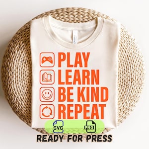 May include: Cream-colored t-shirt with the words "PLAY LEARN BE KIND REPEAT" in orange, along with related icons. The shirt is displayed on a woven, circular surface. The bottom of the shirt has the words "READY FOR PRESS" and SVG and PNG icons.