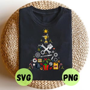 May include: Black t-shirt with a Christmas tree design made from mechanic tools, including a wrench, drill, and piston. The tree is topped with a gold star and decorated with gifts, candy canes, and holly. The shirt is on a woven surface.
