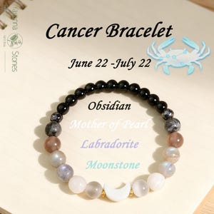 May include: A beaded bracelet featuring black obsidian, grey labradorite, and white moonstone beads, centered with a white crescent moon charm. Text reads: Cancer Bracelet, June 22-July 22, Obsidian, Mother of Pearl, Labradorite, Moonstone.