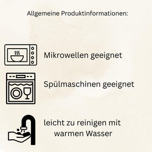 May include: Image with German text and icons indicating product features. The text states the product is microwave-safe, dishwasher-safe, and easy to clean with warm water. Icons show a microwave, dishwasher, and a faucet.