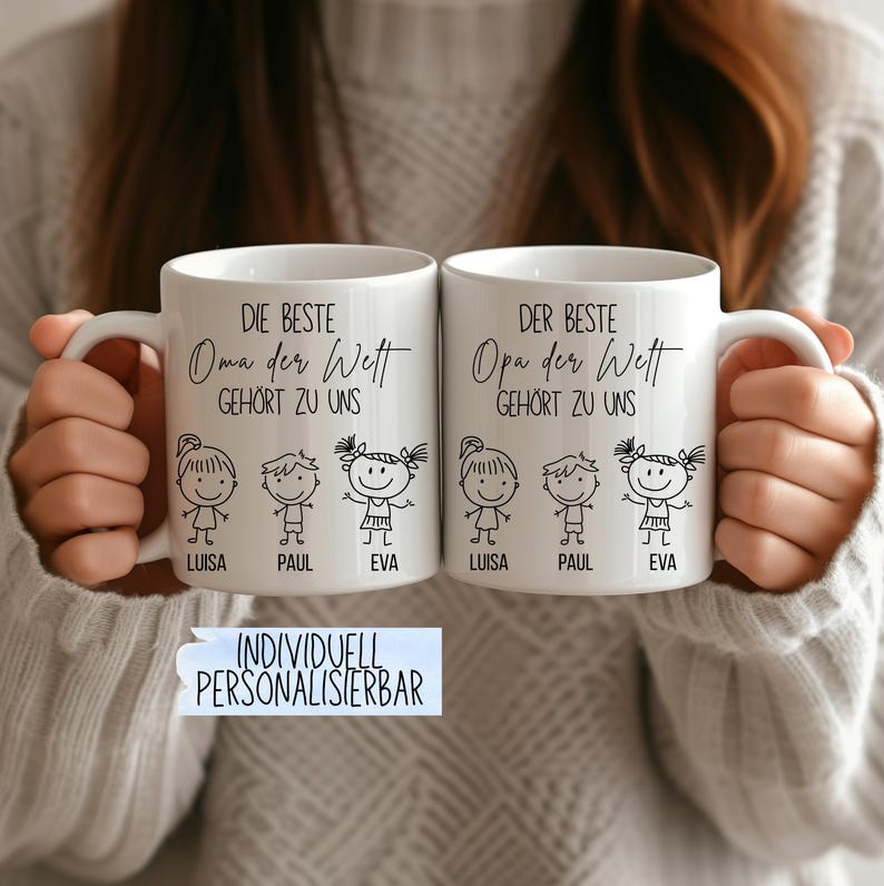 May include: Two white ceramic mugs with black text and illustrations. One mug says "DIE BESTE Oma der Wett GEH&Ouml;RT ZU UNS" and the other says "DER BESTE Opa der Wett GEH&Ouml;RT ZU UNS". Each mug has illustrations of children and the names "LUISA", "PAUL", and "EVA".