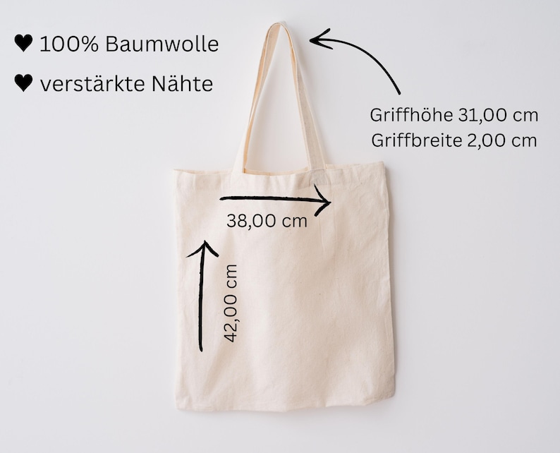 May include: A beige tote bag with cream-colored handles. The bag is 42 cm high and 38 cm wide. The handle height is 31 cm, and the handle width is 2 cm. The text on the bag says "100% Baumwolle" and "verst&auml;rkte N&auml;hte".