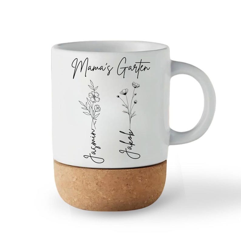 May include: White ceramic mug with a cork base. The mug features the text "Mama's Garten" and the names "Jasmin" and "Jakob" with floral illustrations. The handle is white.