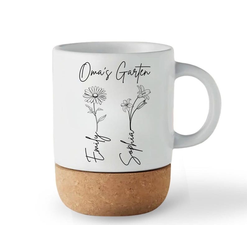 May include: White ceramic mug with a cork base. The mug features the text "Oma's Garten" and the names "Emily" and "Sophia" with floral illustrations. The mug has a curved handle.