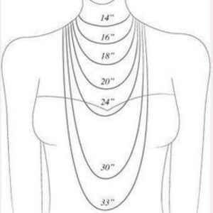 May include: A diagram illustrating necklace lengths, ranging from 14 inches to 33 inches. The image shows how different chain lengths would appear when worn. The lengths are labeled in inches, providing a visual guide for necklace selection.
