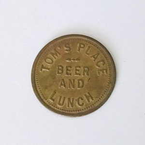 Trade Token Tom&#39;s Place Beer and Lunch Good For 10 Cents Brass Patina Bar Token