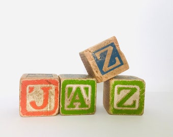 Jazz Spelled In Antique Wood Toy Blocks Genie Slide Christmas Scenes Wooden Children's Toy Illustrations Letters Mixed