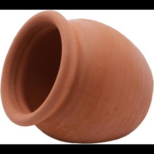 May include: A terracotta pot with a rounded, bulbous body and a wide, thick-rimmed opening. The surface of the vessel is matte and features a natural, earthy reddish-brown color with subtle horizontal texture lines visible across the exterior.