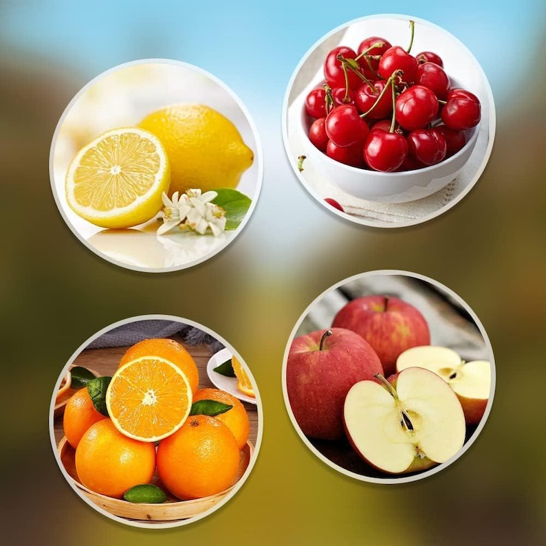 May include: A collection of fresh fruits, including lemons, cherries, oranges, and apples, arranged in circular frames. The lemons are whole and sliced, with blossoms. The cherries are in a white bowl. Oranges are in a basket, and apples are whole and sliced.