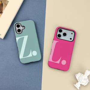 May include: Two phone cases, one teal and one pink, are displayed. The teal case has a large white "Z" and a dot, while the pink case features a white "L" and a dot. Both cases have camera cutouts.