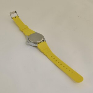 Vintage travel lover watch showing a map of Europe with bright colors, destination graphics, and rotating airplane feature