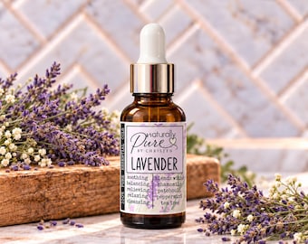 May include: An amber glass dropper bottle labeled Naturally Pure by Christen Lavender 100% Pure Essential Oils. The label lists benefits including soothing, balancing, relieving, relaxing, and cleansing, and notes it blends with chamomile, patchouli, peppermint, and tea tree.