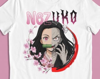 May include: White t-shirt featuring a graphic of a character with black hair, a bamboo muzzle, and the name "Nezuko" in pink and dark pink text. The character is split, showing a normal and a demonic side, surrounded by a red circle and pink cherry blossoms.