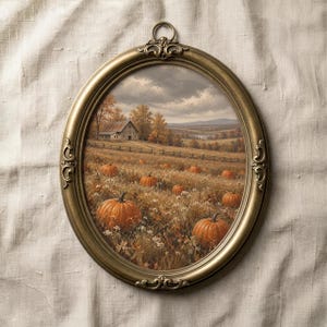 May include: An oval wall art piece featuring a landscape painting of a pumpkin patch with a farmhouse in the distance. The frame is made of antique gold-toned metal with ornate scrollwork details and a small circular hanging loop at the top.
