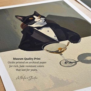 May include: A rectangular art print featuring a black and white tuxedo cat wearing a black suit jacket and bow tie, sitting beside a martini glass. The text reads: Museum Quality Print, Gicl&eacute;e printed on archival paper for rich, fade-resistant colours that last for years. ArNalore Studio.