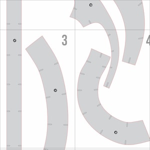 May include: A detailed diagram with gray curved shapes and straight lines, marked with numbers and letters. The shapes have small rectangular cutouts along their edges, and the number "3" is prominently displayed.