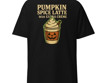May include: Black t-shirt featuring a graphic of a pumpkin spice latte with extra creme. The latte is in a brown cup with a jack-o'-lantern face and a green outline. The text "PUMPKIN SPICE LATTE With EXTRA CREME" is above the latte.