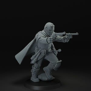 May include: A gray miniature figure of a soldier in a helmet and cape, holding two pistols. The figure is in a combat stance, with one foot forward. The figure is on a black base.