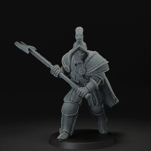 May include: A gray figurine of a warrior in full armor, holding a polearm. The figure has a helmet with a crest, a respirator, and shoulder armor. The warrior stands on a black base, with a dark background.