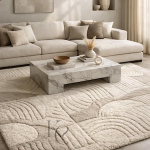 May include: A modern living room featuring a large sectional sofa, a marble coffee table, and a patterned rug. The rug has a beige and cream color scheme with a wave-like design. Decorative pillows and a vase with dried flowers add to the room's aesthetic.