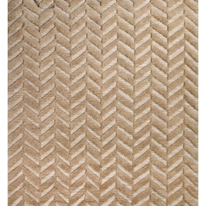 May include: A beige and cream-coloured rug featuring a repeating chevron pattern. The rug has a textured surface and a neutral colour palette, suitable for various interior design styles. The rug's dimensions are not visible.