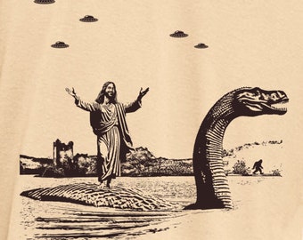 Jesus Christ Riding The Loch Ness Monster Men's Tshirt | Guys Funny Dinosaur Tee | Humorous Religious Tee with Jesus and Nessie