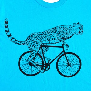 mens cheetah on a bike t shirt American Apparel turquoise, available in S, M, L, XL, XXL WorldWide Shipping image 1