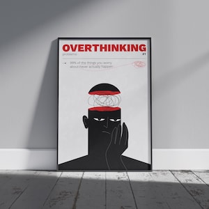 Könnte beinhalten: Gerahmtes Poster mit dem Text "OVERTHINKING problems #1". Die Illustration zeigt eine schwarze Figur mit offenem Kopf, die ein verschlungenes Gehirn offenbart. Der Text lautet "99% der Dinge, über die Sie sich Sorgen machen, passieren nie".