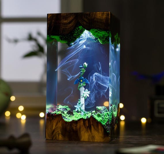 A glowing epoxy-resin sword lamp that looks like it was pulled straight out of Hyrule — functional night light meets display-worthy gaming artifact.