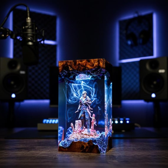 Epoxy resin lamp fusing glowing amber wood tones with Expedition 33 / Clair Obscur game aesthetic — a genuinely handcrafted night light that doubles as sculptural art.