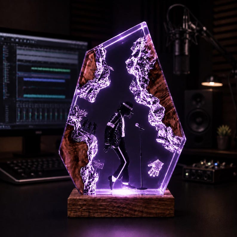 May include: A decorative lamp featuring a translucent resin and wood slab with a purple-lit silhouette of a performer in a sequined jacket and fedora, standing by a microphone. A small glove icon and a sign are embedded within the resin structure.