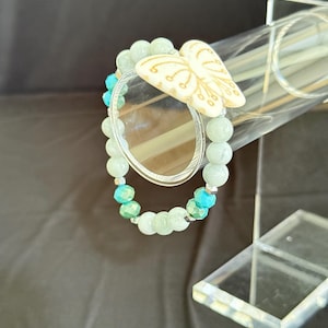 Quartz, Hematite, and Glass Beaded Bracelet with Stone Butterfly