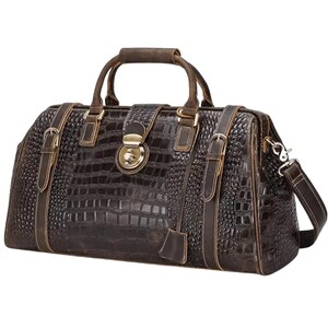 May include: A dark brown leather duffel bag with a crocodile skin texture. The bag has a top handle, a shoulder strap, and metal hardware. The bag is rectangular and has a classic, vintage style.