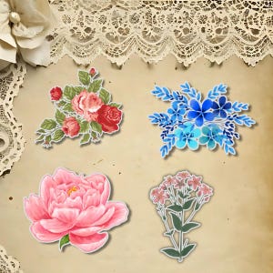 May include: Four floral stickers in a variety of styles. One features red and pink roses with green leaves. Another shows blue flowers. A large pink peony and a cluster of small pink flowers complete the set. The stickers are on a textured, tan background.