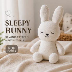 May include: A soft white bunny toy with closed eyes and a stitched black nose and mouth. The text "SLEEPY BUNNY" is above "SEWING PATTERN & INSTRUCTIONS" and "PDF PATTERN". The bunny is on a beige blanket.