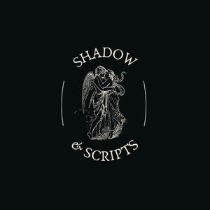 May include: Black background with a cream-colored illustration of two figures embracing, possibly angels. The text "SHADOW & SCRIPTS" is arched above and below the illustration, within a circular design.