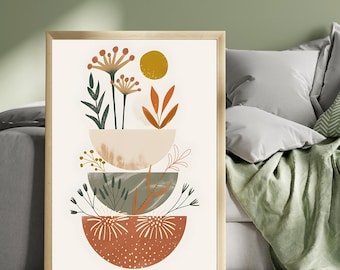 May include: A framed art print with a botanical design. The artwork displays stacked, bowl-like shapes in beige, green, and rust, decorated with floral and leaf motifs. A golden sun and delicate plant illustrations complete the composition.