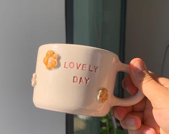 Handmade Ceramic Daisy Mug: Unique Pottery Cup