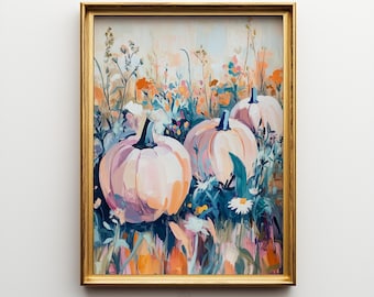 May include: A framed art print featuring a painterly scene of three pale pink pumpkins nestled among wildflowers in shades of orange, teal, and white. The artwork is enclosed in a thin gold-toned frame and includes the text Elm Tree Prints.