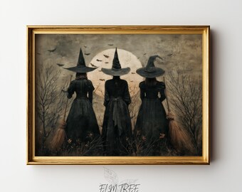 May include: A framed print featuring three witches in black dresses and hats, standing in front of a full moon. The artwork has a vintage aesthetic, with bats flying in the sky and bare trees in the background. The frame is gold.