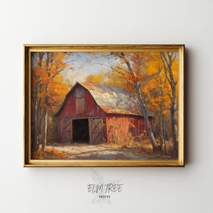 Puede incluir: Pintura enmarcada de un granero rojo con una puerta abierta, rodeado de árboles con hojas otoñales de color naranja y amarillo. La obra de arte está enmarcada en un marco dorado. La pintura está firmada "ELM TREE PRINTS".