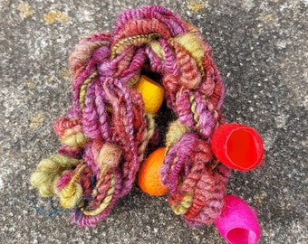 Handspun Art Yarn, Wool and Lotus Fibre Yarn with Silk Cocoons, corespun,spiral, coiled yarn, heavily textured yarn, unique yarn.