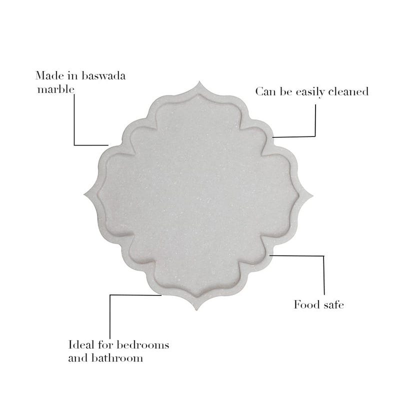 May include: A white marble tray with a scalloped edge. The text on the image says it is made of baswada marble, can be easily cleaned, is food safe, and ideal for bedrooms and bathrooms.