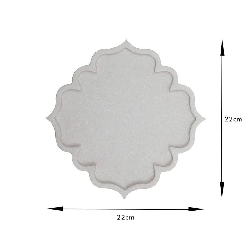 May include: A light gray decorative tray with a unique, scalloped quatrefoil design. The tray measures 22 cm (8.6 inches) in both width and height. The tray has a textured surface and a raised edge.